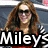 A pixelated image of a woman with long brown hair and sunglasses, overlaid with text and symbols.