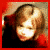Four- of a child with light hair against red and dark backgrounds, showing varied facial expressions and head positions