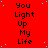 Red background with repeated black text "You Light Up My Life" and scattered cyan dots, with a gray rectangle in the bottom-right corner.