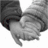 Black-and-white image of two hands clasped together, one hand wearing a dark sleeve.