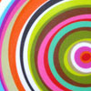 A static circular pattern of concentric rings in multiple colors including red, orange, yellow, green, blue, purple, pink, brown, black, white, and gray.