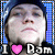 Pixelated image of a person with light skin and dark hair wearing a blue hooded garment, with text below reading "I [pink heart] Ram" against a blue checkered background.