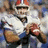 A pixelated image of a football player in a white uniform with blue numbers, holding a football, with the word BEAST in bold black-and-white text below.
