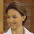A pixelated image of a person with brown hair wearing a white shirt, next to green text reading 'Original Icons .com' on a dark background.