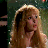A static image featuring a woman with long blonde hair on the left and pixelated text on the right, presented as part of an animated contact sheet frame.