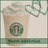 Pixelated image of a light brown paper cup with green circular logo, topped with white foam and a green swirl design on the right.