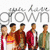 Group of seven people standing side-by-side with 'grown' text above them, displayed in a