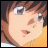 Pixelated anime-style character face with brown hair and light eyes, next to stylized text on black background.