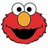 Red cartoon character with large white eyes, black pupils, and a yellow nose smiling broadly against a white background.