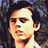 Pixelated image of a person with dark hair on left, red background with text 'I LOVE PB <3' on right.