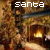 Animated sequence showing a fireplace with flames and text changing across frames, including 'santa', 'hurry down the chimney tonight' in pixelated font.