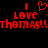 Red pixelated text on black background reads "I ❤️ LOVE THOMAS!!THOMAS!!" with heart symbol replacing 'love' in first line.