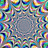 A static image of a colorful, pixelated mandala with concentric rings of blue, green, yellow, and red shapes surrounding a gray center.