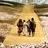 A pixelated animated contact sheet showing two frames of a yellow brick road with figures walking on it and text reading "Follow the yellow brick road".