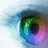 Pixelated abstract composition with swirling green, blue, purple, and pink hues against a light blue gradient background.