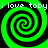 Green and black spiral pattern with repeated text "i love toby" in white pixelated font across four quadrants.