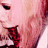 Pixelated close-up of a person's face with light skin tone, dark eye, and red lips, wearing a dark red garment with pink accents.