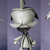 Pixelated figure with large rounded head, thin neck, and segmented limbs against purple background.