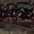 Animated sequence showing graffiti art transitioning to a blue cartoon character with exaggerated facial features holding an object.