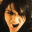 Pixelated image of a person with dark hair and open mouth on left, red text on black background right, gray square bottom right.