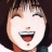 Pixelated image of a smiling character with short dark hair and red lips, next to black background with white text reading "AnimeIM" and "com".