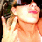 A person with dark hair and sunglasses holds a hand near their face, with text reading "THAT'S HOT" in the lower right corner.