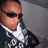 Pixelated image of a person wearing sunglasses and a dark jacket with white text, set against a blue background with bold black text reading SEX ME BiTCH !.