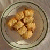 A static image divided into four quadrants: top-left shows a glass bowl of tater tots on a brown surface, top-right and bottom-left have black pixelated text on cyan backgrounds reading "give me your tots!", bottom-right is solid gray.
