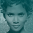 Static 48x48 pixel icon showing a low-resolution grayscale portrait of a person with short hair, visible facial features including eyes, nose, and mouth, set against a light background with teal-toned edges.