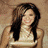 A four- shows a woman with long brown hair in different poses and outfits against varied backgrounds, including text reading 'kelly clarkson' on the bottom right