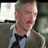 Static 48x48 pixel icon showing a close-up of a person in formal attire with blurred background elements.