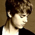 A four- shows a person with brown hair, text reading GREECE and BIEBS with a red heart symbol, and the phrase IamProudOfUBB on purple background
