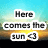 Pixelated text reads 'Here comes the sun' over a gradient background with blue sky, yellow sun, and brown ground.