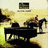 Pixelated image of a person riding a horse in a cart with text labels 'Candle in the Wind', 'Crocodile Rock', and 'Bennie and the Jets' on black background.