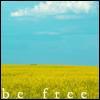 Static image of a field with yellow flowers under a blue sky with white clouds, with the text 'be free' at the bottom.
