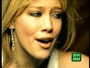 A sequence of showing a person with blonde hair and earrings in various facial expressions, each frame containing a small green square icon