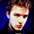 Pixelated close-up of a person's face with brown hair against a blue background, rendered in low-resolution 256x256 pixels.