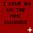 Red background with repeated black text "I LOVE #4 ON THE MMC COUGARS" and scattered white pixelated symbols including crosses and dots.