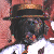 A pixelated image shows a figure in a straw hat and white shirt with red background, next to red text reading 'Gangsta' on a dark background.
