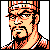 Pixelated 50x50 static buddy icon of a man with orange and black facial features, wearing a checkered cap against gray background.