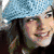 Six distinct views of a woman with long brown hair in various settings and outfits, including a blue knit hat, red headscarf, and beach scene.
