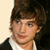 A 2x2 contact sheet of three sampled frames from an animated icon featuring a young man with brown hair in various poses and backgrounds, displayed on a gray transparency background.