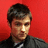 A pixelated image of a person with short dark hair against a solid red background, next to black text reading "Blake Lewis I'd tap that".