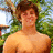 A pixelated image shows a shirtless person with brown hair standing outdoors, next to a red with pink text reading 'HOTTIE!!!'