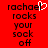 Red background with black pixelated text reading "rachael rocks your sock off" and a white heart-shaped cursor icon over the 'l' in "rachael".