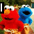 Animated sequence showing Elmo and Cookie Monster with changing text overlays: 'I', 'Luv', and 'Elmo' appear sequentially over the characters.