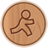 Circular wooden-textured icon with a brown outline of a stick figure walking on a light brown background.
