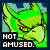 A 4x3 contact sheet of a green cartoon dragon's face with yellow eyes, each frame displaying the text "NOT AMUSED." in red and white lettering against a light blue background.