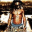 Pixelated image of a shirtless person with long hair wearing blue shorts, standing in front of a dark background with light-colored elements.