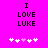 Bright pink background with black pixelated text "I LOVE LUKE" and five white/pink pixelated hearts below.